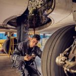 FAA Certified Mechanic checking a landing gear