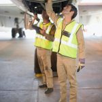 Aircraft workers checking airplane