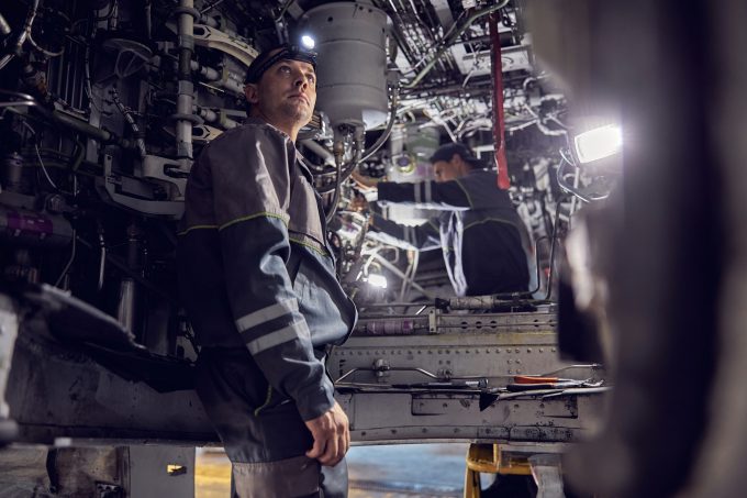 Mechanic working on aircraft.