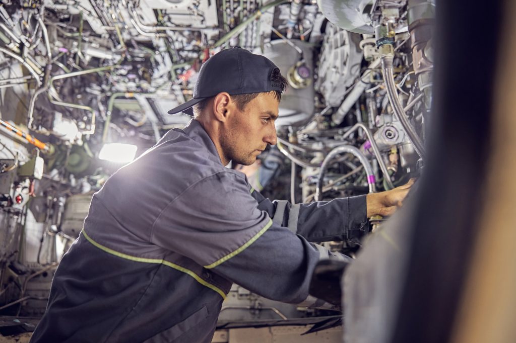 FAA Repair Station Technician checking a commercial airplane